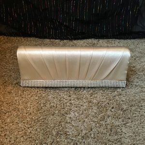Cream satin purse.